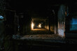 Burnt interior of industrial building basement. Walls in black soot after fire