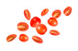 Falling tomatoes slices on white background.
