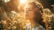 A young woman is standing amidst a field of flowers bathed in warm golden sunlight. Her eyes are gently closed, and she appears serene, soaking in the rays of the setting sun. Delicate white flowers a
