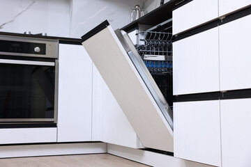 Canvas Print - Built-in dishwasher with open door in kitchen, low angle view