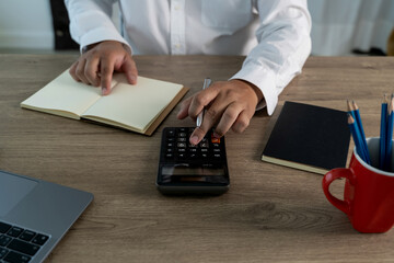 Poster - Close up businessman using calculator on documents Unrecognizable finance use calculate about cost at office