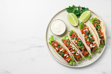 Sticker - Delicious tacos with meat and vegetables served on white marble table, top view. Space for text