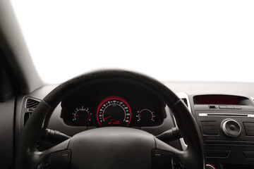 Speedometer on dashboard and steering wheel inside car