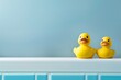 yellow rubber ducks on the edge of the bathroom