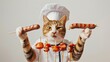 The chef cat holds the sausages on the barbecue wooden skewers. White background.