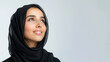 © pariketan - Arab woman wearing black criss cross dress smile isolated on gray