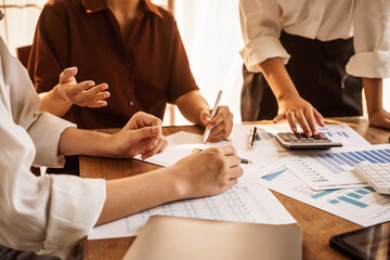 Analyzing startup group meetings to offer advice and make decisions. We assess discussions, offer insights, and assist in reaching conclusions for better business outcomes, hands close up at desk.