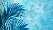 © Chananporn - Blue painted wall with palm leaf shadow. Summer tropical background.