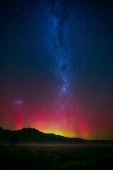 Rare aurora australis southern light with milky way long
exposure photo near Fox Glacier, New Zealand