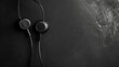 © lovetnihouse - Headphones on black background. Music concept. Top view.