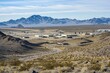 © Giantdesign - Surrounding Mountain Ranges And Rugged Terrain That Provide Natural Barriers to Access to Area 51, Adding to The Isolation And Secrecy of The Base, Generative AI