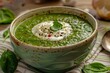 Close up of creamy spinach soup in a bowl