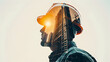 © Atipong - The double exposure image of the engineer standing back during sunrise overlay with cityscape image. The concept of engineering, construction, city life and future.