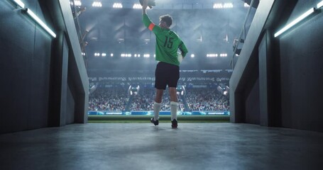 Wall Mural - Traditional Soccer Walkout: Successful Goalkeeper Entering a Massive Football Stadium to the Noise and Raised Cheering Hands of the Anticipating Fans. Epic Back View Footage of an Athlete