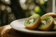 Fresh kiwi fruit on plate on table