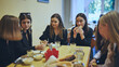 Senior girls having breakfast in the school canteen.