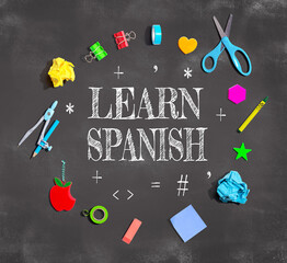 Wall Mural - Learn Spanish theme with school supplies on a chalkboard - flat lay