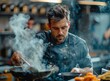 Focused male chef cooking in a commercial kitchen
