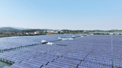 Wall Mural - aerial video of solar power farms on water next to rural townships