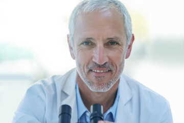 Poster - Science, microscope and portrait mature man in lab for biotech engineering, innovation and research. Laboratory, test and scientist checking sample for pharmaceutical development in medical study.