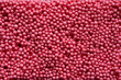 close up of red foam beads for the background