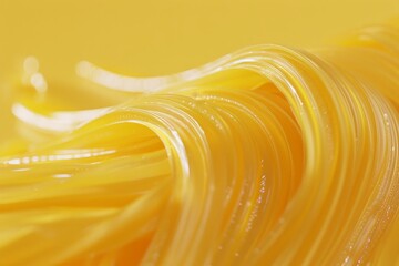 A close up of yellow noodles, with a focus on the texture