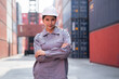 Portrait cross arm Asia logistic engineer woman worker or foreman working at container site	