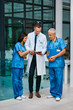 © peopleimages.com - Doctor, nurse and team with tablet for research or telehealth communication or online, consultation or teamwork. Men, woman and medical app for client conversation or internet, website or insurance