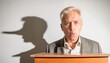 © Marko - man at a podium with a shadow suggesting a long nose, implying dishonesty