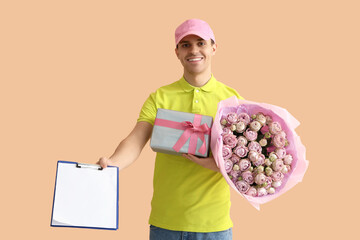 Wall Mural - Male courier with bouquet of roses, gift and clipboard on beige background