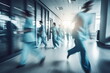 Medicine workers walk down a hospital corridor. Blurred motion