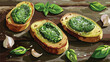 Tasty toasts with pesto sauce and garlic on table 