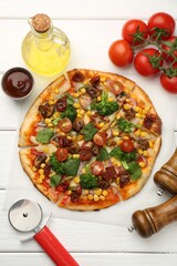 Wall Mural - Delicious vegetarian pizza served on white wooden table, flat lay
