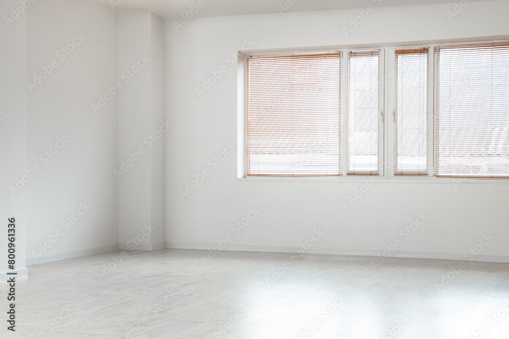 View of empty room with laminate floor and window