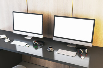 Poster - Two empty white gaming computer monitor on desk with coffee cups and headsets. Place for your advertisement. Gaming club concept. Mock up, 3D Rendering.