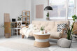 © Pixel-Shot - Interior of beautiful living room with comfortable sofa, coffee table and workplace