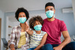 Family is wearing facemasks during coronavirus and flu outbreak. Virus and illness protection, COVID