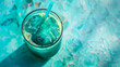 Glass of blue matcha tea on turquoise background