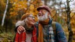 © liliyabatyrova - A couple of older people are smiling and hugging each other in a forest