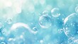 Abstract art meets tranquility in this soft blue background filled with floating liquid bubbles