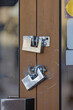 Double Stainless Steel Padlocks at Metal Door Safety