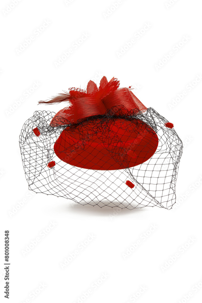 Close-up shot of a red felt pillbox hat with a veil decorated with volume flower, beads and feathers. The hat with an alligator clip is isolated on a white background. Front view.