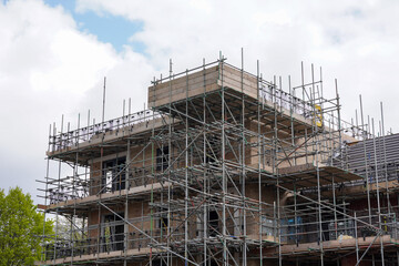 construction site with scaffolding. new housing development of apartment flats in the uk