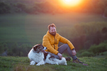 Happy dog and man playing outdoor