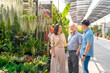© CandyRetriever  - Adult Asian couple with elderly man father choosing and buying plant at plant shop street market on summer vacation. Family relationship, fathers day and senior people mental health care concept.
