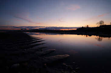 Wall Mural - Sunset on Tagus river in Lisbon. View on Bridge