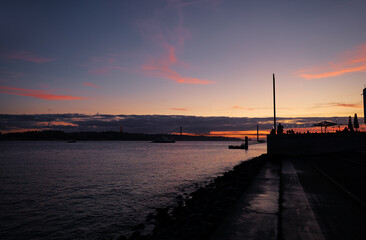 Poster - Sunset on Tagus river in Lisbon. View on Bridge