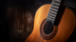 © alexkich - Classical guitar close up, dramatically lit on a black background with copy space