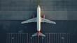 © Ruslan Gilmanshin - Top down view on commercial airplane docking in terminal in the parking lot of the airport apron, waiting for services maintenance, refilling fuel services after airspace lock down