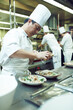 © peopleimages.com - Asian man, chef and plate with food in kitchen for restaurant, service and hospitality in Thailand. Male cook, gourmet meal and nutrition for fine dining, wellness and catering for hotel in Bangkok